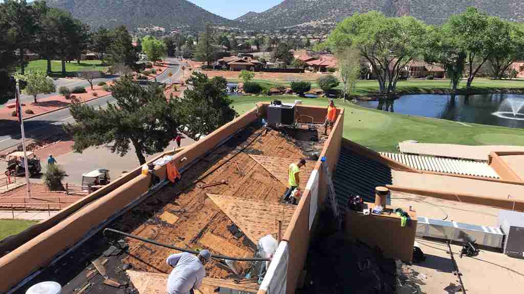new roof in progress with asphalt and pvc